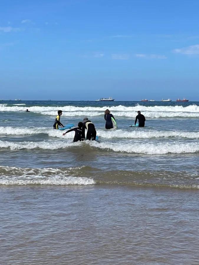 A surfer riding a wave in Morocco — Surf and Paradise Valley day trip