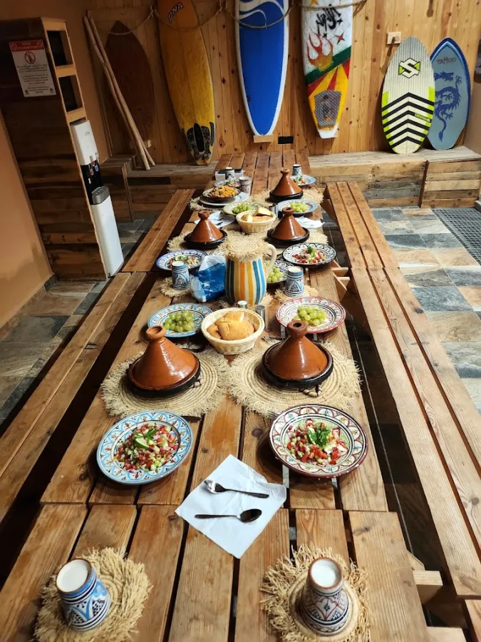 A shared meal at a Moroccan surf house — Mouhou House surf stay, Taghazout