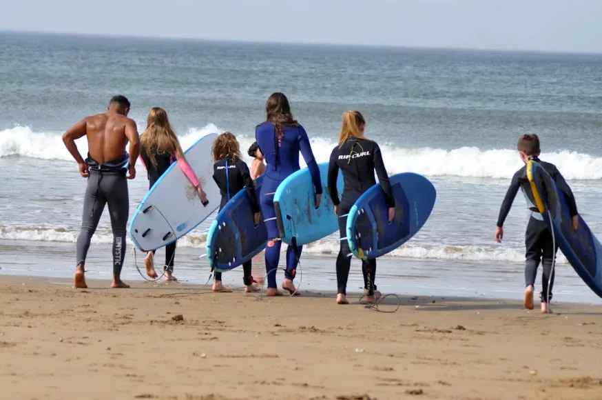 A surf group on the beach — Surf and quad biking in the Timlalin dunes
