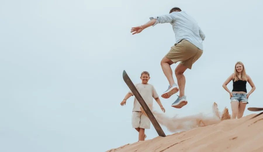 Sandboarding on a desert dune — Surf and quad biking in the Timlalin dunes