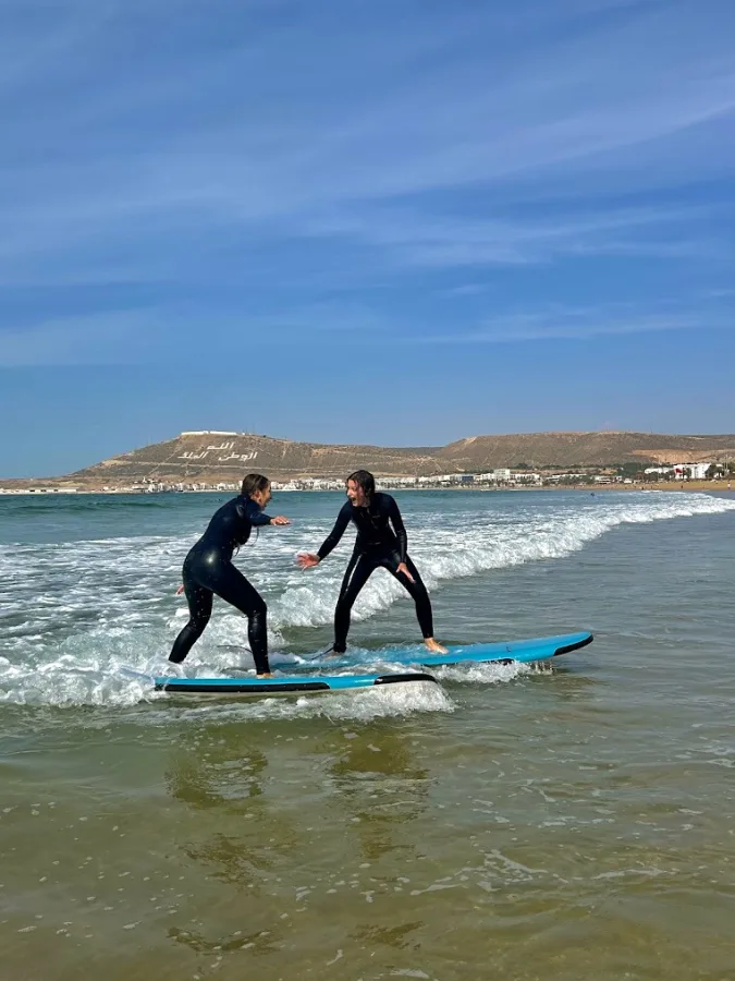 A surfer riding a wave in Morocco — Surf and Paradise Valley day trip